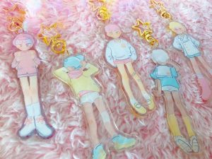 keychains of pastel school boys wearing different kinds of uniforms