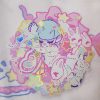 holographic sticker of a anime boy tied up in rope with bunnies around